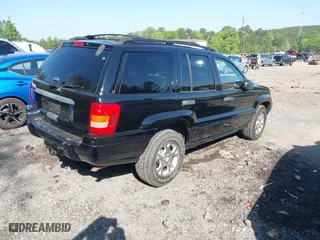 1999 Jeep Grand Cherokee Laredo with VIN 1J4GW58S5XC687480, listed as a IAAI auction lot 42016415 with 186,776 mi miles. Bid and sale history available at carsss.com. Image 4.