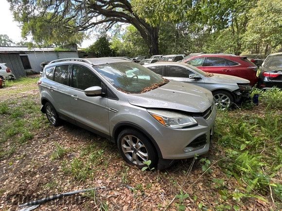 2016 Ford Escape Titanium with VIN 1FMCU9JXXGUC33190, listed as a Copart auction lot 51374865 with 222,129 mi miles and Clean Title. Bid and sale history available at carsss.com. Image 1.