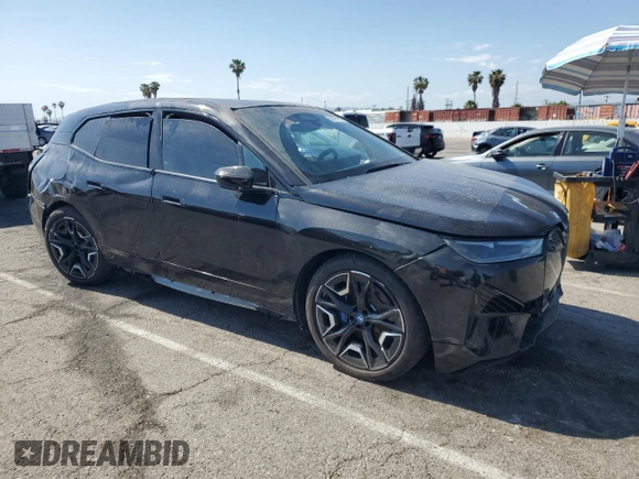 2025 BMW iX xDrive50 z VIN WB523CF02SCS06555, wystawiony jako Copart lot #55291115 z przebiegiem Nie podano mil oraz Szkoda całkowita • Salvage title. Historia ofert i sprzedaży dostępna na DreamBid. Obrazek 4.