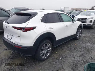 2021 Mazda CX-30 Select with VIN 3MVDMBBL3MM205256, listed as a IAAI auction lot 41302313 with 17,709 mi miles and . Bid and sale history available at DreamBid. Image 4.