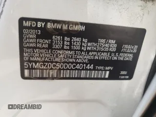 2013 BMW X6 M with VIN 5YMGZ0C50D0C40144, listed as a Copart auction lot 64889554 with 91,024 mi miles and Salvage Title. Bid and sale history available at carsss.com. Image 12.