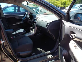 2010 Toyota Corolla with VIN 2T1BU4EEXAC463697, listed as a IAAI auction lot 42099807 with 206,160 mi miles. Bid and sale history available at carsss.com. Image 5.