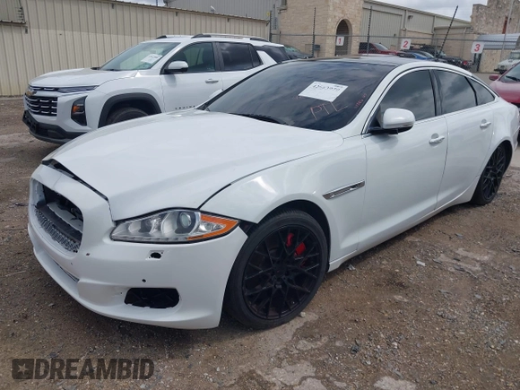 2014 Jaguar XJ R with VIN SAJWA1EK3EMV58692, listed as a IAAI auction lot 42663979 with 111,386 mi miles and . Bid and sale history available at DreamBid. Image 2.