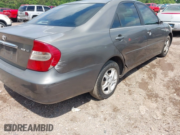 2004 Toyota Camry LE with VIN 4T1BE30K24U921028, listed as a IAAI auction lot 42187174 with 295,174 mi miles and . Bid and sale history available at DreamBid. Image 6.