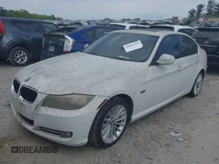 2011 BMW 3 Series 335i with VIN WBAPM5C51BE575704, listed as a IAAI auction lot 42005354 with 205,263 mi miles. Bid and sale history available at carsss.com. Image 2.