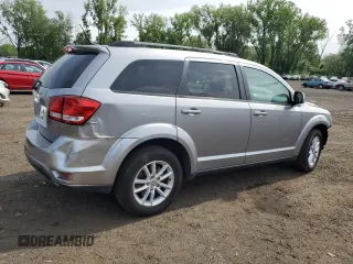 2017 Dodge Journey SXT with VIN 3C4PDDBG4HT608395, listed as a Copart auction lot 60811885 with 145,503 mi miles and Salvage title. Bid and sale history available at DreamBid. Image 3.