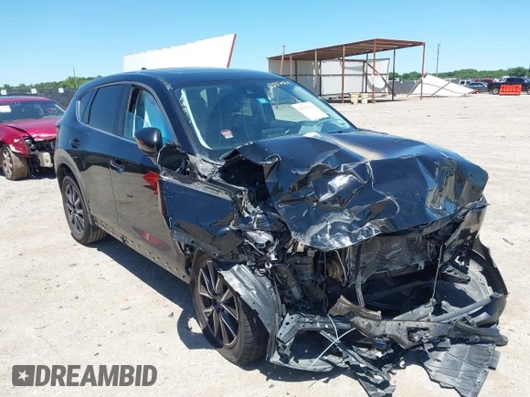 2018 Mazda CX-5 Touring z VIN JM3KFACM3J1339074, wystawiony jako IAAI lot #42317039 z przebiegiem 82 799 mil mil oraz . Historia ofert i sprzedaży dostępna na DreamBid. Obrazek 1.