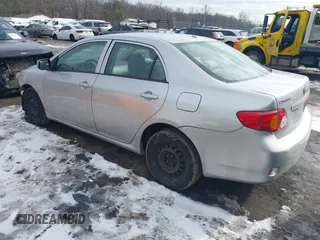2009 Toyota Corolla with VIN 1NXBU40E19Z009548, listed as a IAAI auction lot 41310085 with 122,944 mi miles. Bid and sale history available at carsss.com. Image 3.
