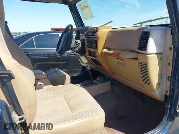 2000 Jeep Wrangler Sport with VIN 1J4FA49S0YP770943, listed as a IAAI auction lot 41817600 with 165,379 mi miles and . Bid and sale history available at DreamBid. Image 5.