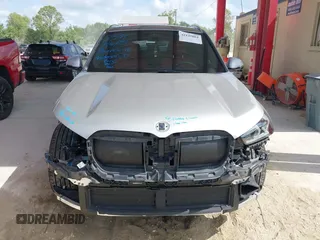2023 BMW X1 xDrive28i z VIN WBX73EF09P5W51069, wystawiony jako IAAI lot #42145061 z przebiegiem 24 960 mil mil oraz . Historia ofert i sprzedaży dostępna na DreamBid. Obrazek 13.