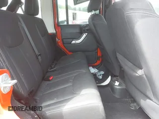 2015 Jeep Wrangler Unlimited Rubicon z VIN 1C4BJWFG4FL598033, wystawiony jako IAAI lot #42435523 z przebiegiem 134 202 mil mil oraz . Historia ofert i sprzedaży dostępna na DreamBid. Obrazek 8.