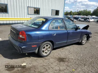 2001 Daewoo Nubira CDX z VIN KLAJB52Z31K647237, wystawiony jako Copart lot #69299834 z przebiegiem 51 513 mil mil oraz Szkody całkowita. Historia ofert i sprzedaży dostępna na DreamBid. Obrazek 3.