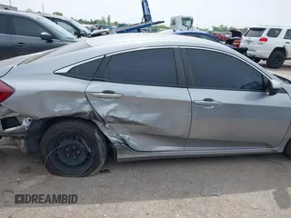 2019 Honda Civic LX with VIN 19XFC2F66KE026931, listed as a IAAI auction lot 41885137 with 55,057 mi miles and . Bid and sale history available at DreamBid. Image 13.