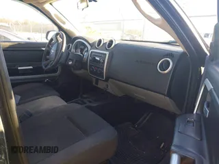 2009 Mitsubishi Raider LS z VIN 1Z7HC28K89S729753, wystawiony jako IAAI lot #41696576 z przebiegiem 169 373 mil mil oraz . Historia ofert i sprzedaży dostępna na DreamBid. Obrazek 5.