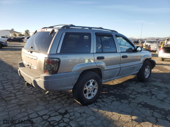 1999 Jeep Grand Cherokee Laredo with VIN 1J4GW58NXXC747537, listed as a Copart auction lot 87310234 with 0 mi miles and Salvage Title. Bid and sale history available at carsss.com. Image 3.