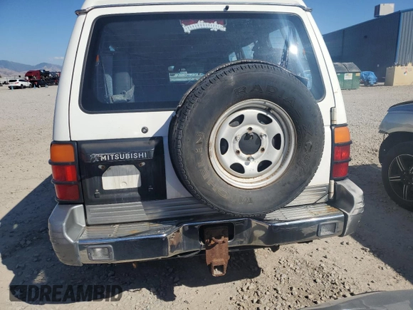 1995 Mitsubishi Montero z VIN JA4MR41H3SJ004800, wystawiony jako Copart lot #72036354 z przebiegiem 209 635 mil mil oraz Szkoda całkowita • Salvage title. Historia ofert i sprzedaży dostępna na DreamBid. Obrazek 6.