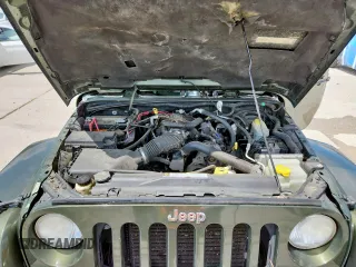 2008 Jeep Wrangler Unlimited Sahara with VIN 1J4GA59148L608970, listed as a Copart auction lot 64433495 with 134,055 mi miles and Salvage title. Bid and sale history available at DreamBid. Image 12.