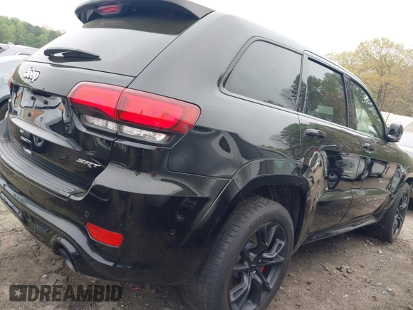 2017 Jeep Grand Cherokee SRT z VIN 1C4RJFDJ7HC683240, wystawiony jako IAAI lot #41919995 z przebiegiem 122 030 mil mil oraz . Historia ofert i sprzedaży dostępna na DreamBid. Obrazek 21.