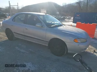 1996 Hyundai Elantra z VIN KMHJF34M9TU209019, wystawiony jako IAAI lot #41328956 z przebiegiem 95 180 mil mil oraz . Historia ofert i sprzedaży dostępna na DreamBid. Obrazek 1.