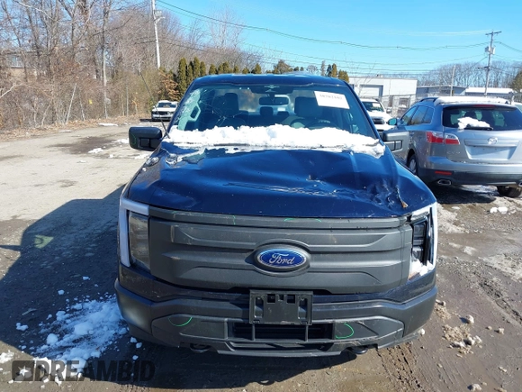 2023 Ford F-150 Lightning Pro with VIN 1FTVW1EL7PWG07081, listed as a IAAI auction lot 38702102 with 9,976 mi miles and . Bid and sale history available at DreamBid. Image 12.