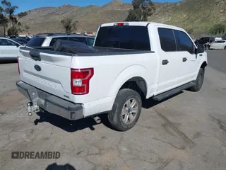 2018 Ford F-150 XL with VIN 1FTEW1CP0JKC28072, listed as a IAAI auction lot 41558764 with 153,402 mi miles. Bid and sale history available at carsss.com. Image 4.