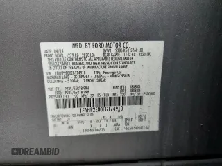 2014 Ford Taurus SEL z VIN 1FAHP2E80EG174910, wystawiony jako Copart lot #56070945 z przebiegiem 147 201 mil mil oraz Szkody całkowita. Historia ofert i sprzedaży dostępna na DreamBid. Obrazek 12.