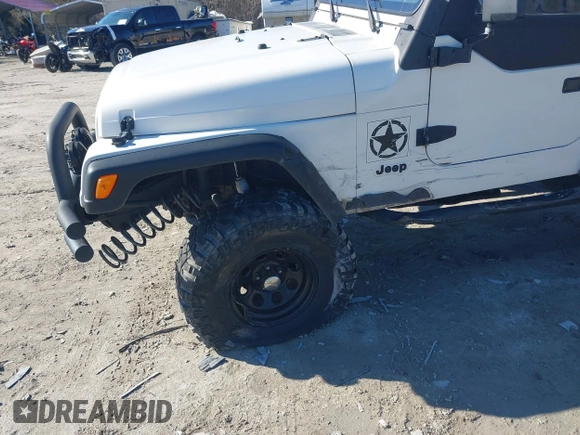 1997 Jeep Wrangler Sport with VIN 1J4FY19S7VP483735, listed as a IAAI auction lot 41469983 with 150,542 mi miles. Bid and sale history available at carsss.com. Image 6.