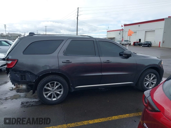 2015 Dodge Durango Limited with VIN 1C4RDJDG1FC873918, listed as a IAAI auction lot 41593090 with 137,871 mi miles and . Bid and sale history available at DreamBid. Image 14.