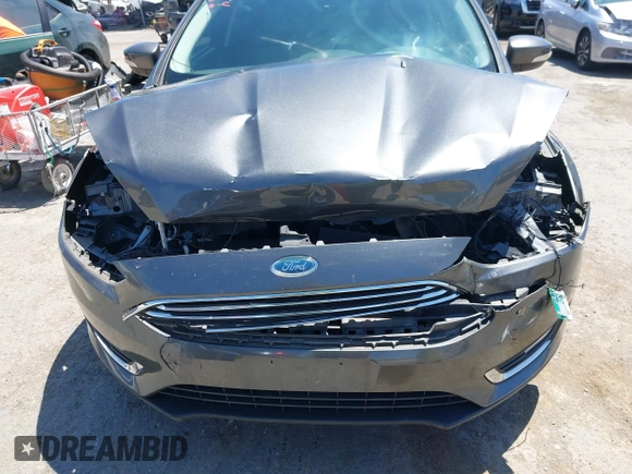 2018 Ford Focus Titanium with VIN 1FADP3N28JL232120, listed as a IAAI auction lot 42544070 with 28,661 mi miles and . Bid and sale history available at DreamBid. Image 6.
