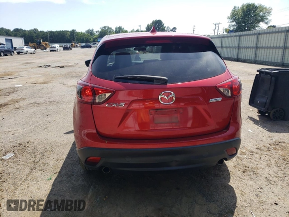 2016 Mazda CX-5 Grand Touring z VIN JM3KE2DY0G0722334, wystawiony jako Copart lot #59998185 z przebiegiem 51 449 mil mil oraz Szkoda całkowita • Salvage title. Historia ofert i sprzedaży dostępna na DreamBid. Obrazek 6.