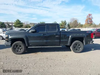 2017 Chevrolet Silverado 1500 LT with VIN 1GCVKREC0HZ293560, listed as a IAAI auction lot 40706331 with 133,438 mi miles. Bid and sale history available at carsss.com. Image 14.