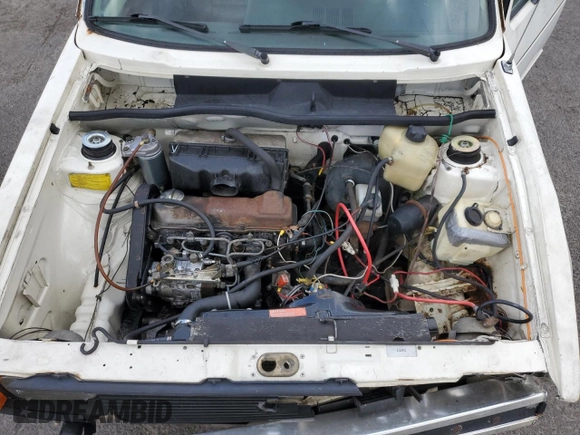1981 Volkswagen Rabbit z VIN 1VWFG0179BV177022, wystawiony jako Copart lot #65369204 z przebiegiem 168 444 mil mil oraz Szkody całkowita. Historia ofert i sprzedaży dostępna na DreamBid. Obrazek 11.
