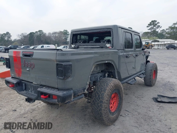2021 Jeep Gladiator Rubicon with VIN 1C6JJTBG7ML554354, listed as a IAAI auction lot 41796943 with 61,513 mi miles and . Bid and sale history available at DreamBid. Image 4.