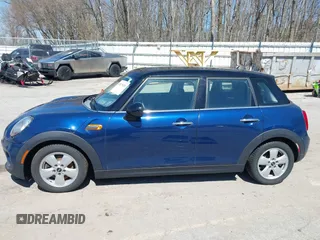 2015 MINI Hardtop 4 Door with VIN WMWXS5C58FT829805, listed as a IAAI auction lot 42023026 with 141,330 mi miles and . Bid and sale history available at DreamBid. Image 14.