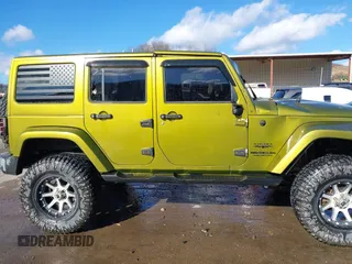 2007 Jeep Wrangler Unlimited Sahara with VIN 1J4GA59187L189519, listed as a IAAI auction lot 41204036 with 165,428 mi miles and . Bid and sale history available at DreamBid. Image 13.