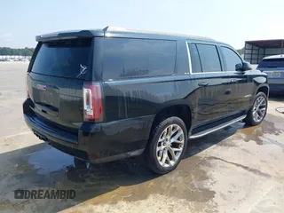 2016 GMC Yukon XL SLE with VIN 1GKS1FKC9GR161876, listed as a IAAI auction lot 39948106 with 60,800 mi miles. Bid and sale history available at carsss.com. Image 4.