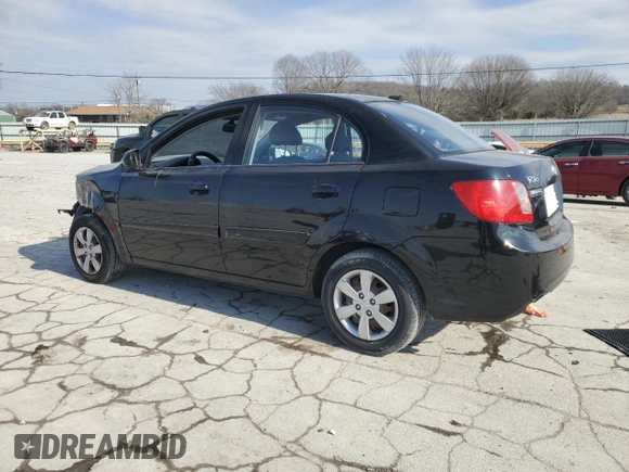 2010 Kia Rio LX with VIN KNADH4A3XA6652808, listed as a Copart auction lot 42597245 with 164,768 mi miles and Salvage Title. Bid and sale history available at carsss.com. Image 2.