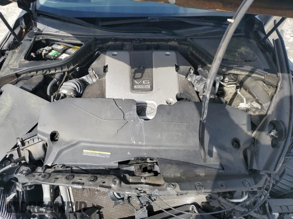 2015 Infiniti Q50 Premium z VIN JN1BV7AR9FM401311, wystawiony jako Copart lot #57159075 z przebiegiem 79 133 mil mil oraz Szkoda całkowita • Salvage title. Historia ofert i sprzedaży dostępna na DreamBid. Obrazek 11.