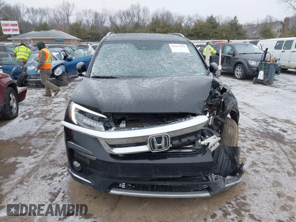 2021 Honda Pilot Touring 8-Passenger z VIN 5FNYF6H94MB091384, wystawiony jako IAAI lot #41567070 z przebiegiem 78 330 mil mil oraz . Historia ofert i sprzedaży dostępna na DreamBid. Obrazek 12.