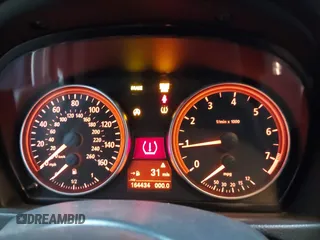 2006 BMW 3 Series 330xi with VIN WBAVD33546KL51295, listed as a IAAI auction lot 41742575 with 164,434 mi miles. Bid and sale history available at carsss.com. Image 7.