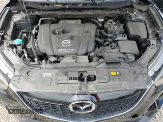 2014 Mazda CX-5 Grand Touring with VIN JM3KE4DY3E0304908, listed as a Copart auction lot 53873655 with 144,382 mi miles and Salvage Title. Bid and sale history available at DreamBid. Image 12.