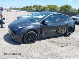 2024 Tesla Model Y with VIN 7SAYGDED3RF019063, listed as a IAAI auction lot 42061888 with 13,763 mi miles and . Bid and sale history available at DreamBid. Image 6.