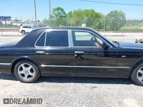 1999 Bentley Arnage z VIN SCBLB51E1XCX01401, wystawiony jako IAAI lot #42133144 z przebiegiem 29 699 mil mil oraz . Historia ofert i sprzedaży dostępna na DreamBid. Obrazek 13.