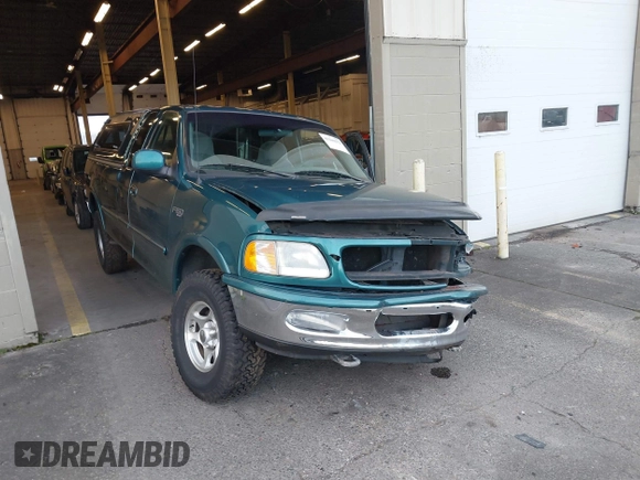 1997 Ford F-150 XL with VIN 1FTEX18L1VKB44867, listed as a IAAI auction lot 41266572 with 105,061 mi miles. Bid and sale history available at carsss.com. Image 6.