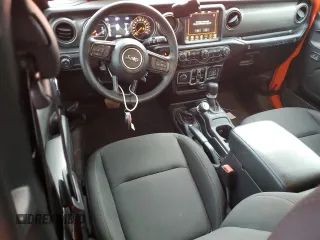 2023 Jeep Wrangler Sport S with VIN 1C4HJXDG6PW675682, listed as a Copart auction lot 41446855 with 22,816 mi miles and Salvage Title. Bid and sale history available at DreamBid. Image 8.