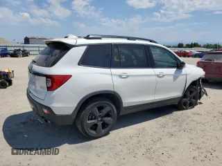 2021 Honda Passport Elite with VIN 5FNYF8H03MB007617, listed as a Copart auction lot 63036345 with 21,757 mi miles and Salvage title. Bid and sale history available at DreamBid. Image 3.