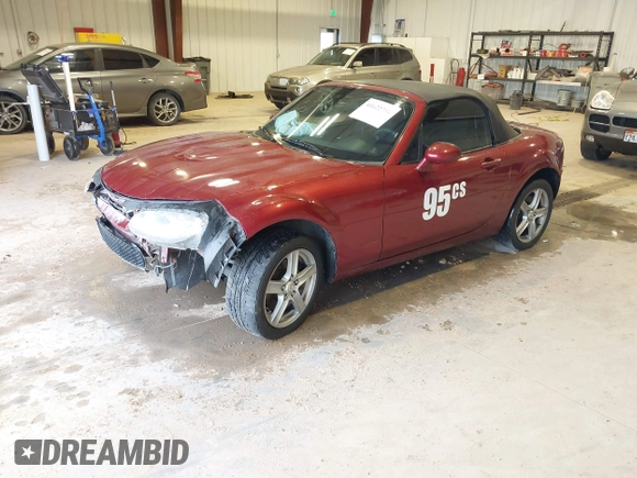 2007 Mazda MX-5 Miata Sport z VIN JM1NC25F970132299, wystawiony jako IAAI lot #41622791 z przebiegiem 72 392 mil mil oraz . Historia ofert i sprzedaży dostępna na DreamBid. Obrazek 18.
