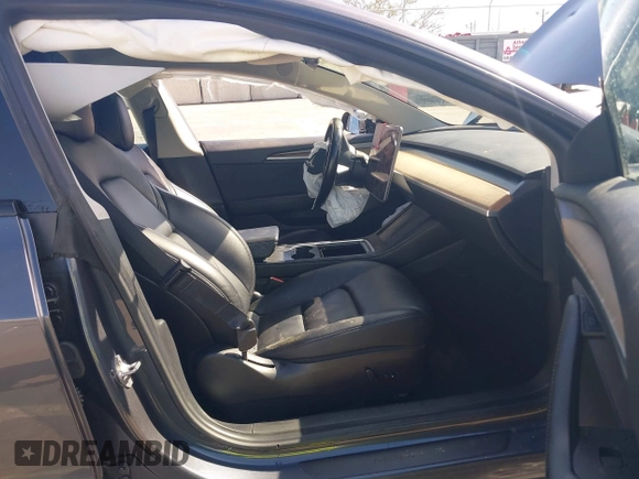 2022 Tesla Model 3 with VIN 5YJ3E1EA1NF142713, listed as a IAAI auction lot 42027630 with 112,557 mi miles. Bid and sale history available at carsss.com. Image 5.