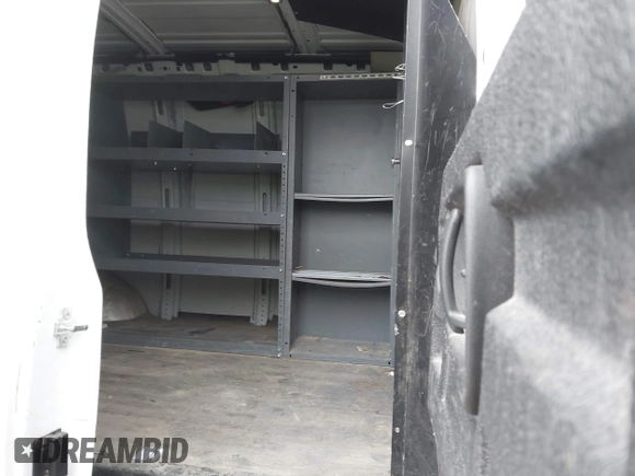 2015 Chevrolet Express Cargo Van with VIN 1GCWGFCFXF1259591, listed as a IAAI auction lot 42029679 with 144,023 mi miles. Bid and sale history available at carsss.com. Image 8.