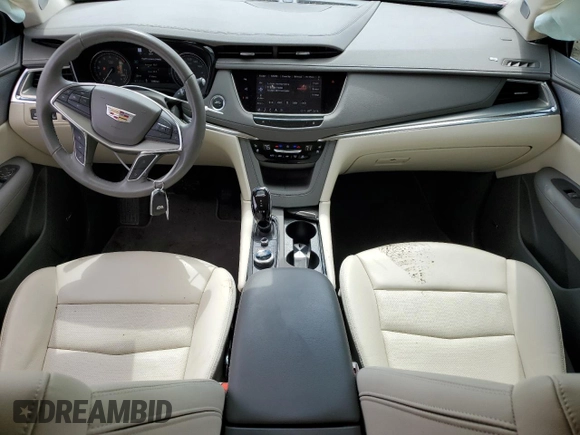 2023 Cadillac XT5 FWD Premium Luxury z VIN 1GYKNCRS5PZ173528, wystawiony jako Copart lot #55805605 z przebiegiem 7 789 mil mil oraz Szkoda całkowita • Salvage title. Historia ofert i sprzedaży dostępna na DreamBid. Obrazek 8.